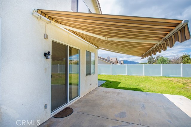 Electronic  retractable awning patio in back  protection from sun and rain