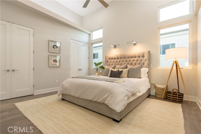 MASTER BEDROOM (BEDROOM #4), LED LIGHTING, DUAL READING LAMPS, CEILING FAN, HIS AND HER CLOSETS