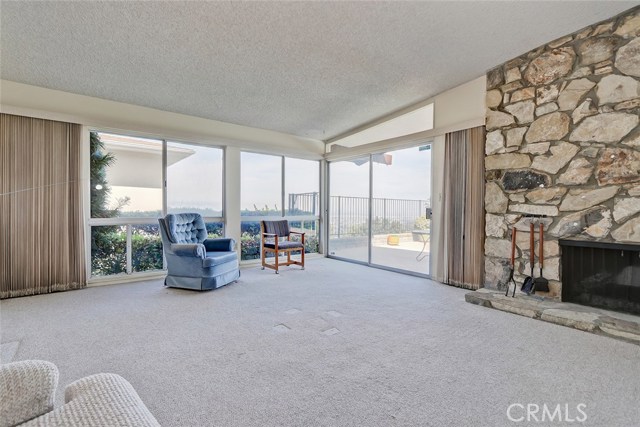 LIVING ROOM LOOKING EAST. FIRE PLACE WITH PALOS VERDES STONE.