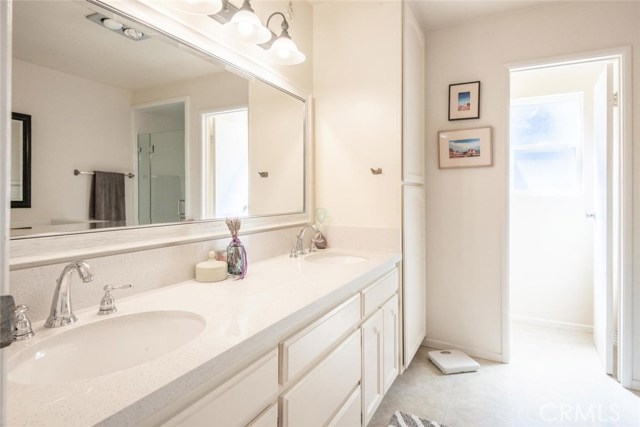 Remodeled master bath with double sink vanity & separate toilet room