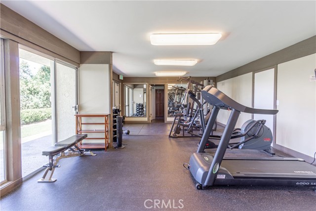 Newer gym with shower rooms on lower level with sauna