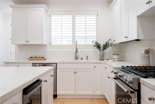 Stainless steel appliances including wine cooler.