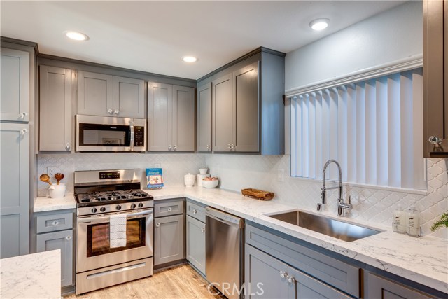 stainless steel appliances and fully remodeled kitchen