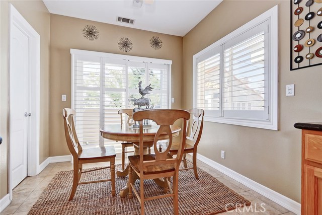 Plantation blinds and breakfast nook make this kitchen stand out from the rest.
