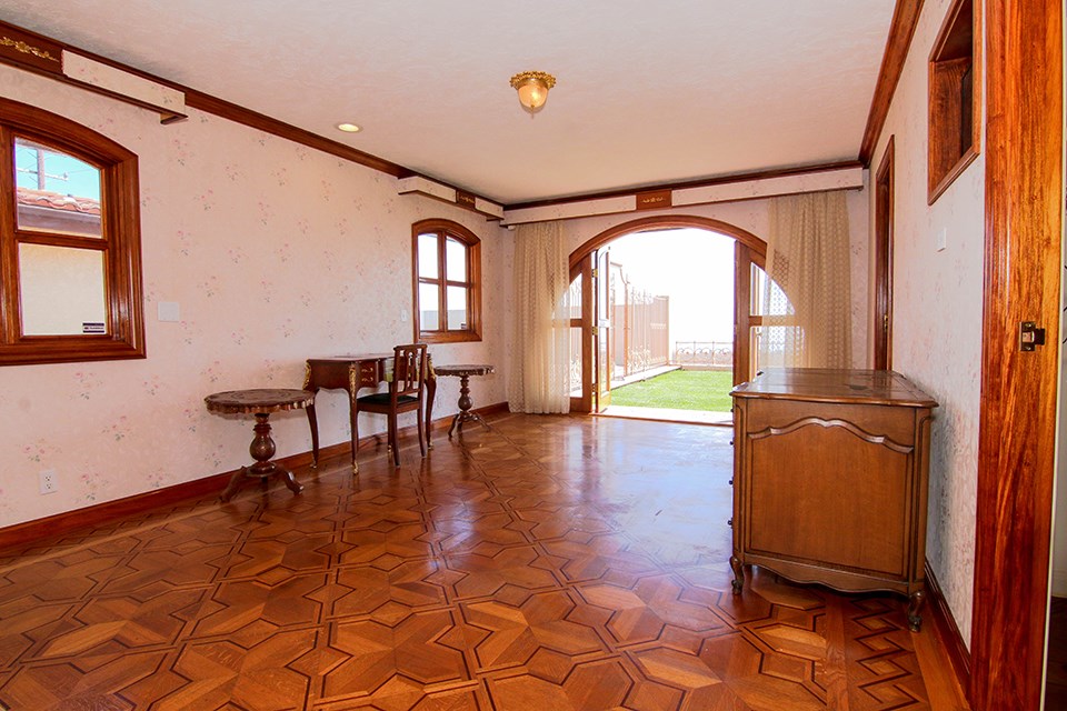 Guest Downstairs Bedroom with imported wood floors and view of Park.