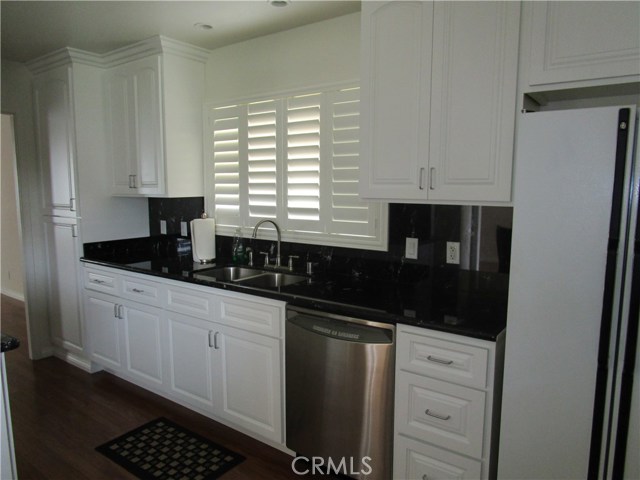 Stunning kitchen with black granite.