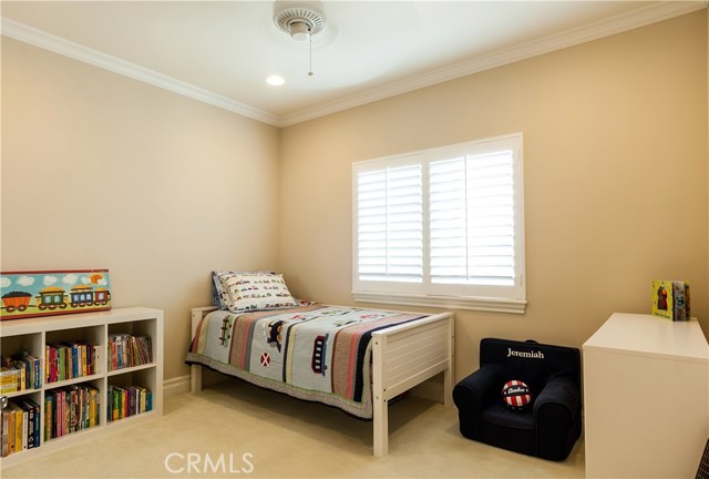 The third bedroom features plantation shutters.