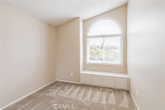 Bedroom 1 with carpet flooring and adorable window seat