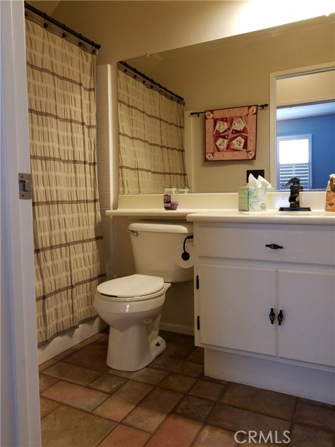 Full Downstairs Bathroom Conveniently Located By the Den And Family Room.