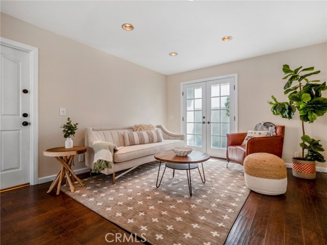 Great room, French doors to patio, and door to the garage