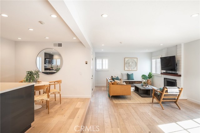 KITCHEN OVERLOOKS DINING AREA AND SPACIOUS LIVING AREA.