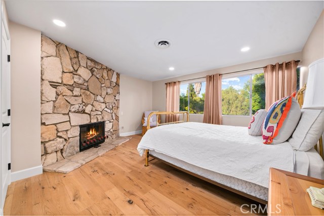 Downstairs large bedroom with a wood burning fireplace that could act as a secondary master bedroom.