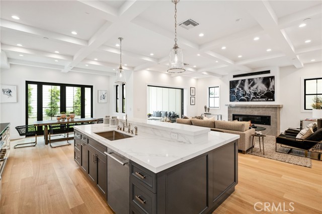 Centrally postured kitchen enhances the open and flowing floor plan