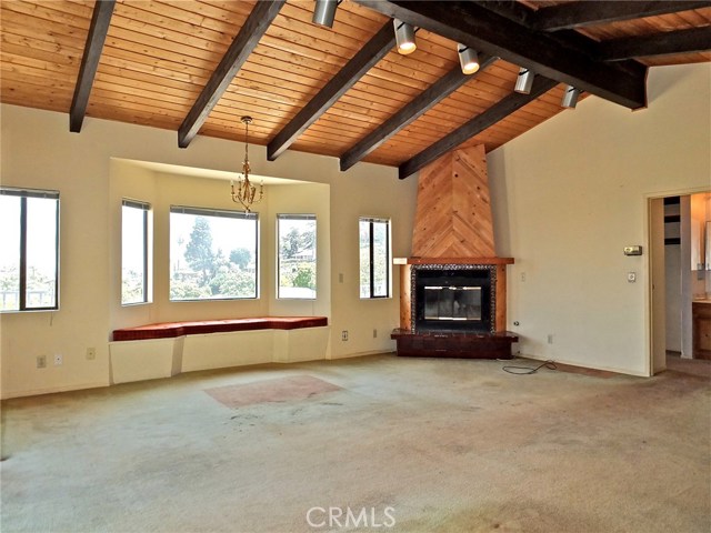 Vaulted ceilings, bay window and gas fireplace featured in the master retreat.