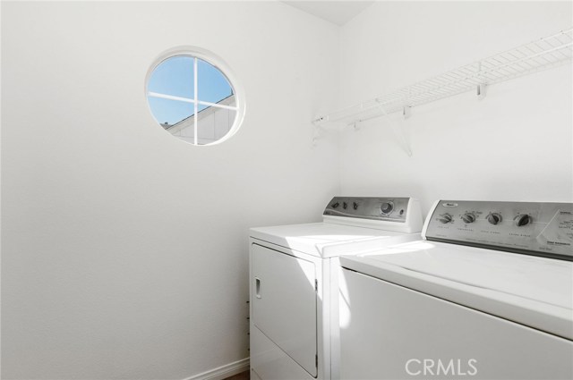 Separate laundry room located off the hallway upstairs.