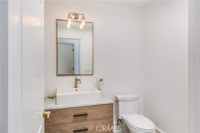 On the main floor, a powder room is conveniently placed for guests