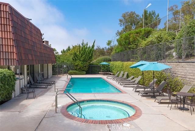 Lap Pool and Spa with 2 Lighted Tennis courts overlooking the pool area