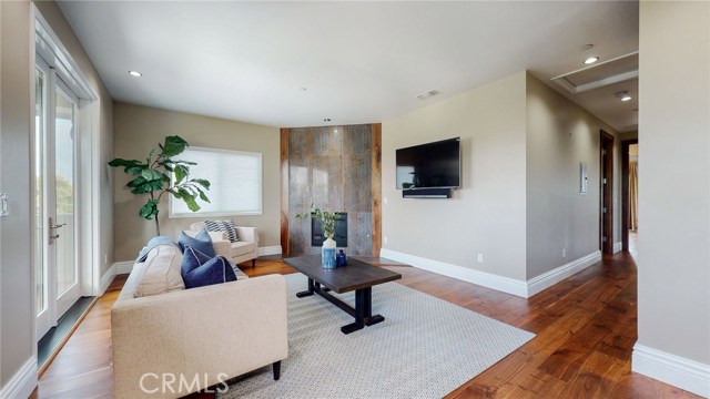 Upstairs Family room with Fireplace and Balcony