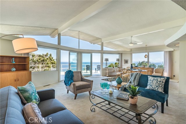 Wide open space with plenty of light from the floor to ceiling windows and double sliders.