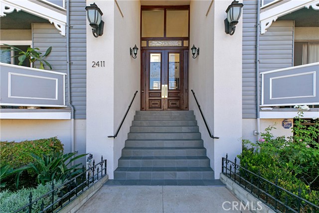 The front steps leading to security doors.