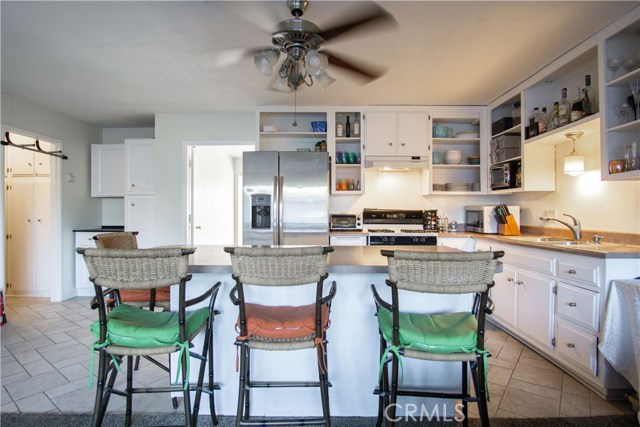 Open floor plan and kitchen with island.