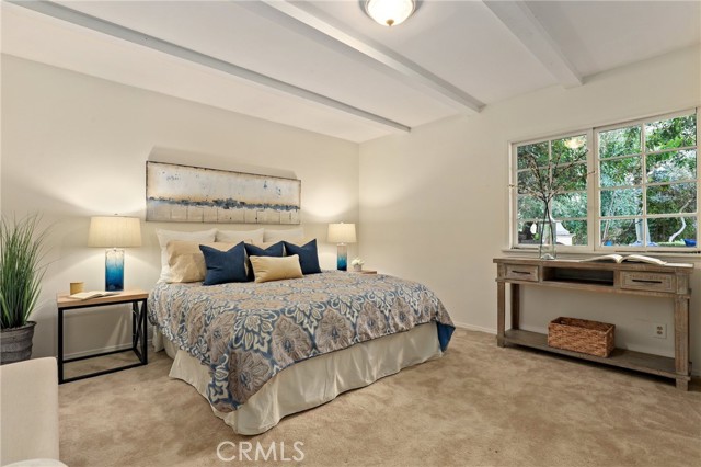 Downstairs bedroom on the left side on its' own, again....wonderfully charming ceilings and plenty of closet space!