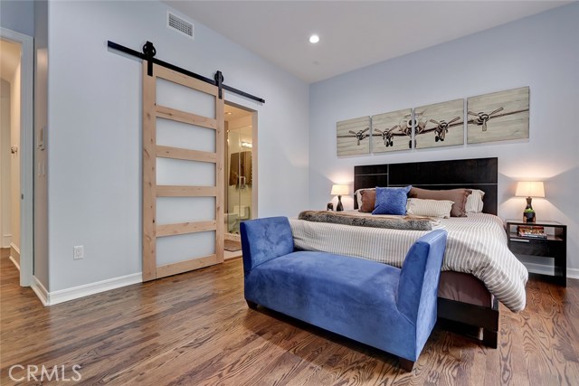 Custom Barn Door maximizes bedroom space