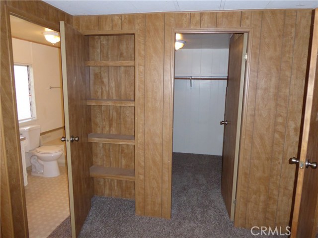 Master Bedroom walk in closet and linen closet.