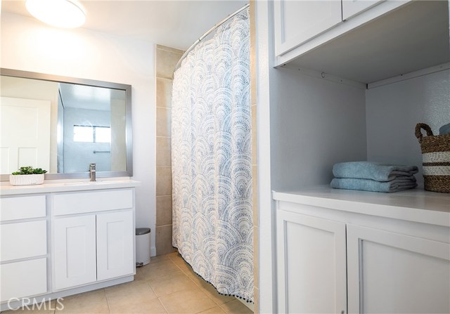 MASTER BATHROOM FEATURES DUAL SINKS, LAUNDRY, SHOWER AND TUB COMBO ALONG WITH BUILT-IN LINEN CLOSET.