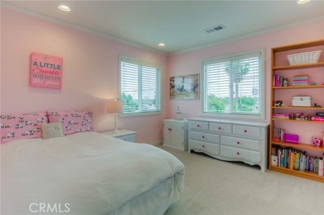 Upstairs bedroom. One of three on main level. Carpeted.