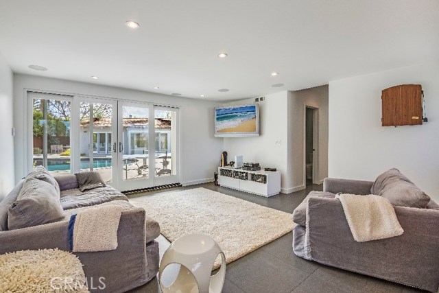 The pool and patio view from the den makes this a favorite part of the home.