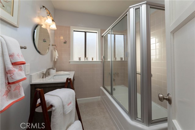 reglazed tub, new floor to the studs, tile, vanity and faucet