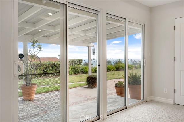 Sliders to yard and patio from master bedroom. Views from here, too!