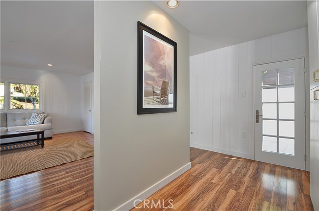 Family Room with Extra Storage Cabinets Leads to Side Yard Area