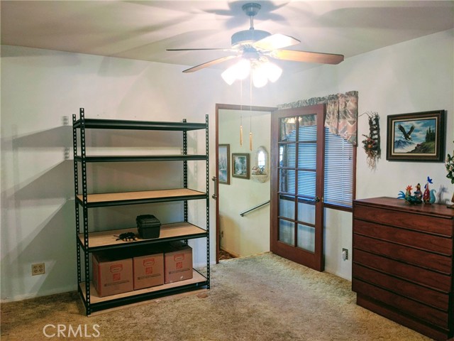 2nd bedroom with extra deep closet with mirrored sliding doors (not shown) that steps down into what could be a 3rd bedroom or family room