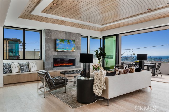 Take in the ocean breeze a gorgeous panoramic view in front of the chic fireplace