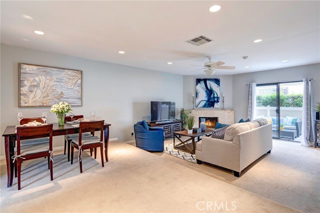 Large dining area capable of seating 6-8 people. Recessed lights, fireplace, bright open floor plan. Living room opens to private patio. Large dining area capable of seating 6-8 people. Recessed lights, fireplace, bright open floor plan. Living room opens to private patio.