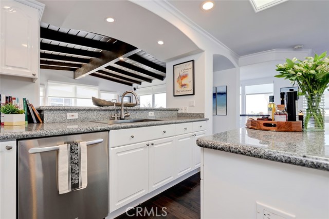 Kitchen Area with Open View to Formal Great Room/Living Area.
