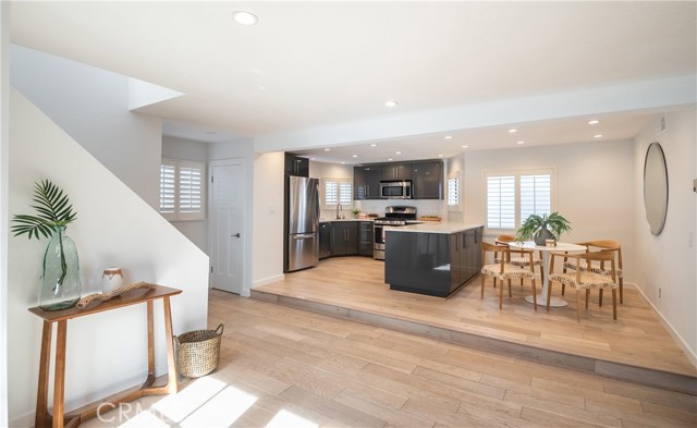 SLEEK MODERN KITCHEN WITH STAINLESS STEEL APPLIANCES AND PLENTY OF COUNTER AND STORAGE SPACE.