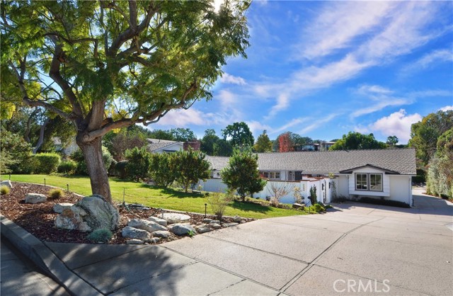 Large Driveway Leads to Three-Car Garage