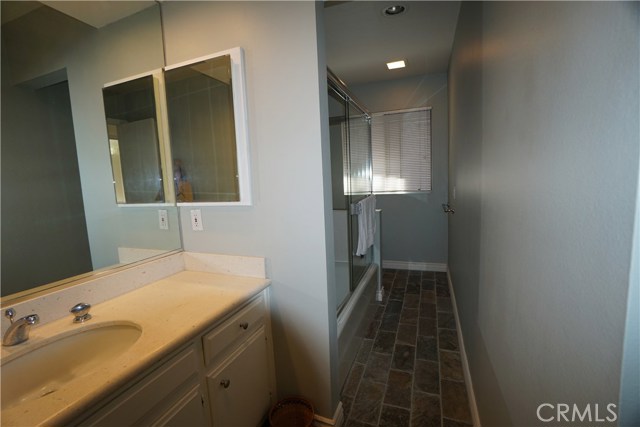 Third bath w/tub and shower, glass enclosure. Limestone counters. Slate flooring.