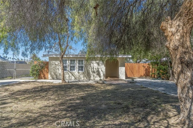 Front of the home with mature trees providing plenty of shade