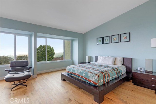 High ceilings and lots of windows create an airy, open feel to this large bedroom suite.