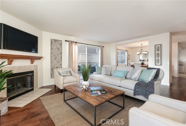 Living room with sliding glass doors to large balcony