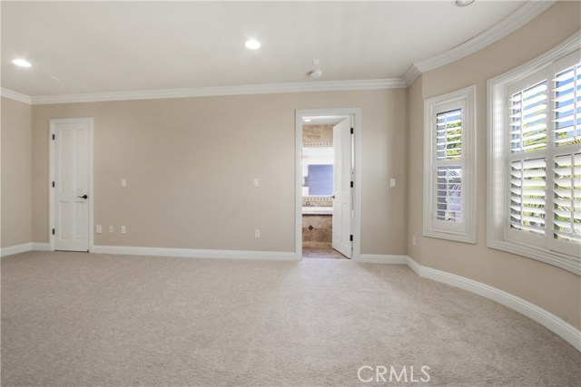 MASTER BEDROOM CROWN MOLDING RECESSEDLIGHTING , PLANTATION SHUTTERS , NEW CARPET AND PAINT