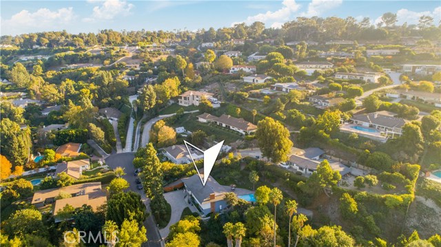 Home surrounded by other custom homes with large and private homesites.