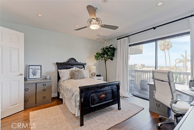Main Floor Master bedroom 1 with balcony and ocean view