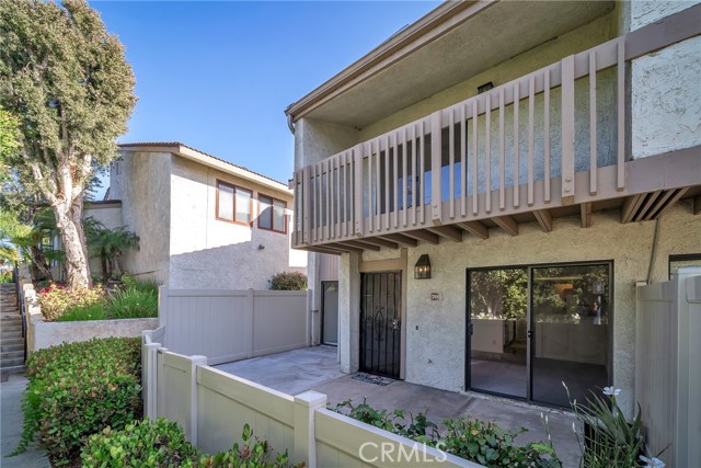 End unit with private patio and balcony.