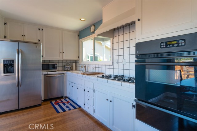 Kitchen leads to rear deck.