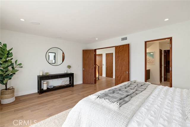 Grand double doors open to the Master suite with private bath (shown here using reverse of 961 Unit A staging)